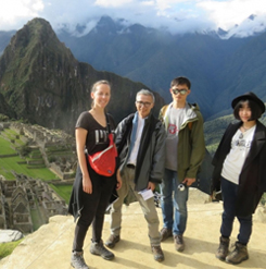 Posing with a panoramic view of Machu Picchu in Peru are (l-r) PhD student Paloma Gonzalez, Associate Professor Takehiko Nagakura, and two MIT graduate students.  Photo courtesy of MISTI