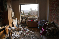 Damage from a missile in an apartment building in Kyiv, Ukraine, Feb. 25.LYNSEY ADDARIO/NYT