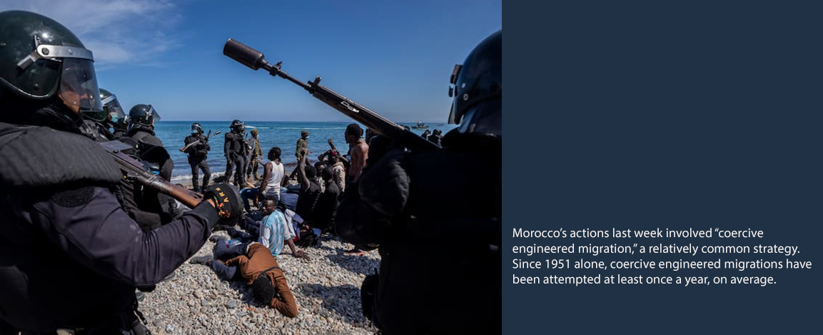 Weaponized migration image showing armed police and refugees