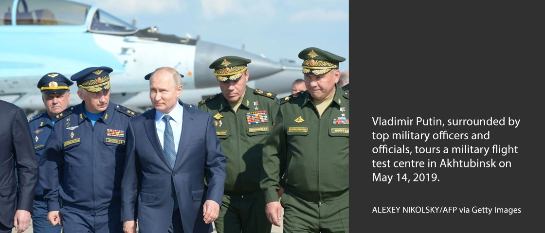 Vladimir Putin, surrounded by top military officers and officials, tours a military flight test centre in Akhtubinsk on May 14, 2019. ALEXEY NIKOLSKY/AFP via Getty Images