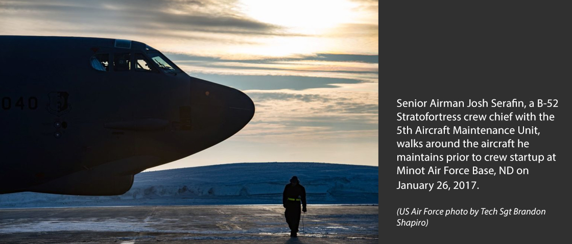Senior Airman Josh Serafin, a B-52 Stratofortress crew chief with the 5th Aircraft Maintenance Unit, walks around the aircraft he maintains prior to crew startup at Minot Air Force Base, N.D. on January 26, 2017. It is not uncommon for temperatures in Minot to dip below minus 20, making maintenance efforts extremely difficult. (U.S. Air Force photo by Tech. Sgt. Brandon Shapiro)