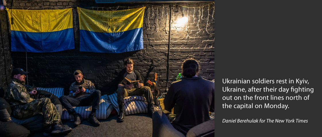 Ukrainian soldiers rest in Kyiv, Ukraine, after their day fighting out on the front lines north of the capital on Monday.Credit...Daniel Berehulak for The New York Times