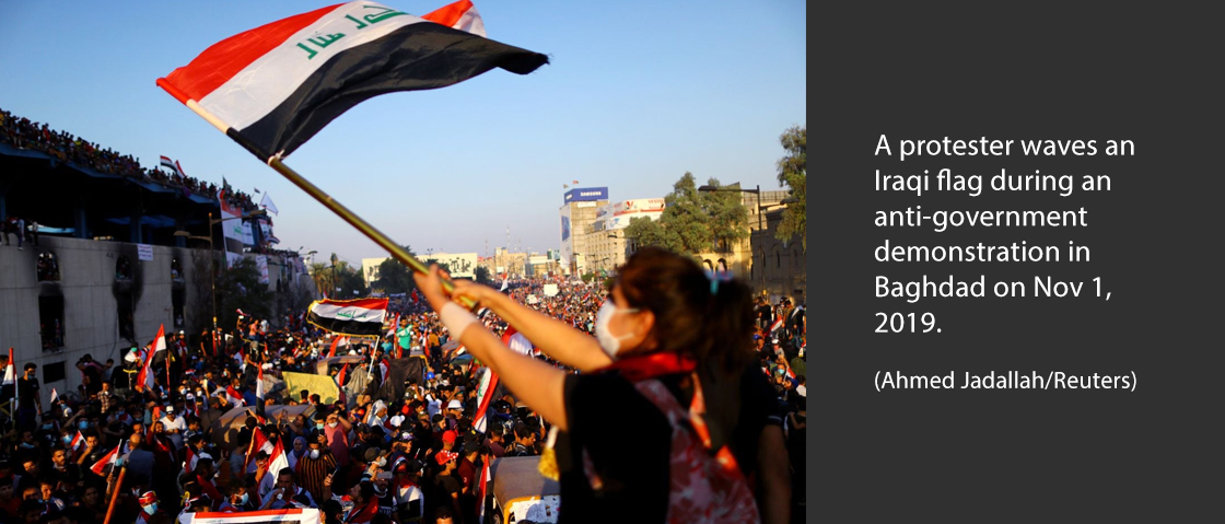 A protester waves an Iraqi flag during an anti-government demonstration in Baghdad on Nov. 1, 2019. (Ahmed Jadallah/Reuters)