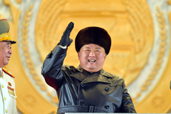 North Korean leader Kim Jong Un waves from a stage during a military parade celebrating a ruling Workers' Party of Korea congress in Pyongyang on Thursday. | KCNA / KNS / VIA AFP-JIJI