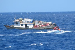 USCG sailors rescuing Haitian refugees
