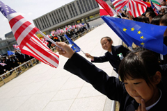 Children hold up flags from the G7 countries in the wind as the foreign ministers visit the Peace Memorial Park, on the sidelines of the G7 Foreign Ministers' Meeting in Hiroshima on April 11, 2016. Kerry and other G7 foreign ministers made the landmark visit on April 11 to the memorial site for the world's first nuclear attack in Hiroshima. (Jonathan Ernst/AFP/Getty Images)