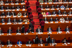 Chinese President Xi Jinping, center, and Premier Li Keqiang, center-right, with other delegates at the second plenary session of China’s National People’s Congress in Beijing on Monday. (Roman Pilipey/Pool/EPA-EFE/Shutterstock)