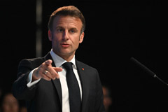 French President Emmanuel Macron gestures as he delivers a speech 