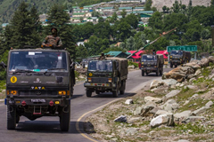 An Indian army convoy drives towards Leh, on a highway bordering China, on June 19. Photographer: Yawar Nazir/Getty Images