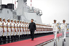 Chinese President Xi Jinping reviews an honor guard