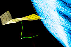 abstract image, black background with blue lines, yellow wave length, and a cyber looking green line