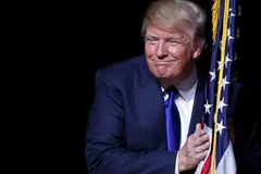 Donald Trump hugging the American flag