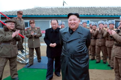 A state media image said to show Kim Jong-un inspecting the testing of a "super-large multiple-rocket launcher" 
