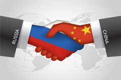 Russia and China shaking hands