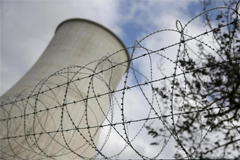 Barbed wire is pictured at the entrance of the Tihange nuclear power station, one of the two large-scale nuclear power plants in Belgium, in this March 26, 2016 file photo. REUTERS/Vincent Kessler