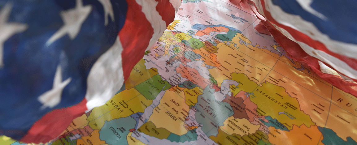 US flag and the world map