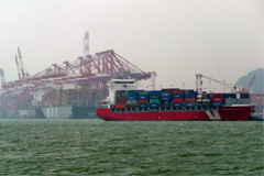 Ships are loaded with cargo at the Shekou Port in Shenzhen, China, on Sept. 3, 2010