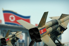North Korea missiles and flag