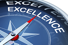 Compass pointing toward Excellence