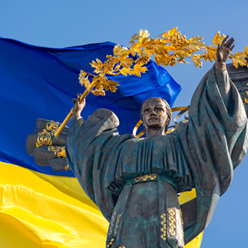 Ukraine Flag with Ukraine statue