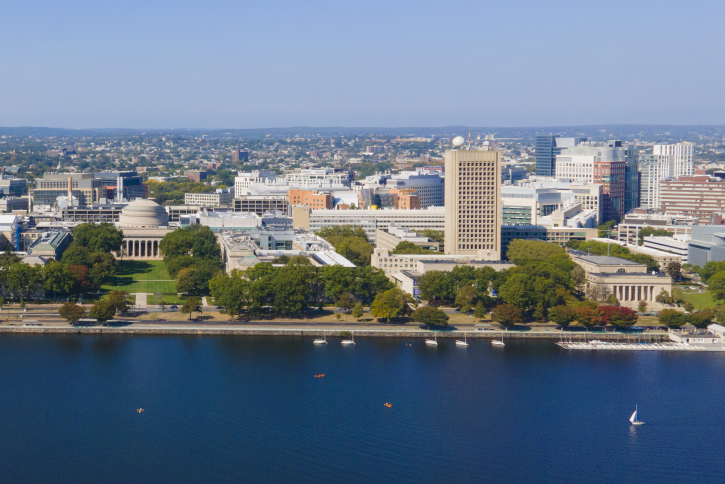 View of MIT from the Charles River with sailboats in front
